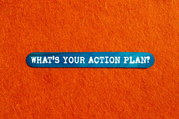 What is your action plan message written on blue wooden stick on orange background. Conceptual what...