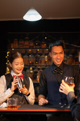  Professional male bartender preparing alcoholic drinks in a bar