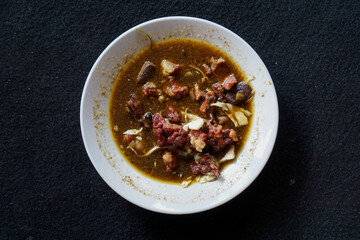 Tongseng is an authentic Indonesian meat stew, typically goat, cooked with sweet soy sauce, shredded cabbage, tomatoes, and coconut milk.