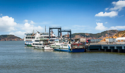 Fototapeta premium Scenic Harbor View with Ferries Docked at a Picturesque Pier