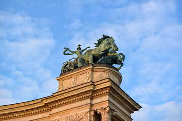 Charioteer with a snake statue symbolizing war. Located on top of the left colonnade at Heroes...