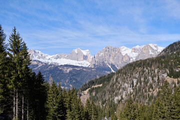 Fototapeta premium March 2025: Scenic view of snow covered mountains against sky, Fassa Valley.