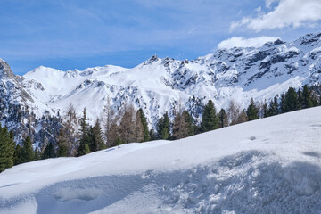 March 2025: Scenic view of snow covered mountains against sky, Fassa Valley.