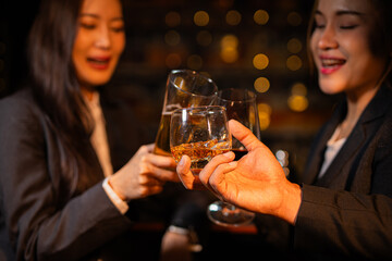 food and drink male friends are happy drinking beer and clinking glasses at a bar or pub.