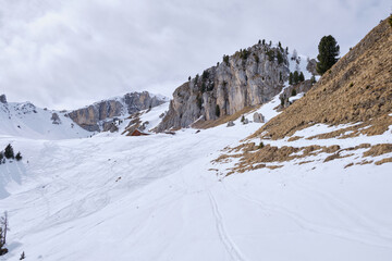 March 2025: Scenic view of snow covered mountains against sky, Fassa Valley.