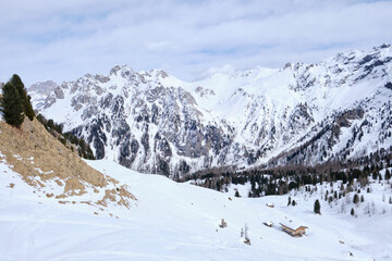 March 2025: Scenic view of snow covered mountains against sky, Fassa Valley.