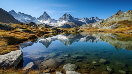 Fototapeta premium Alpine lake reflection with autumn mountains.