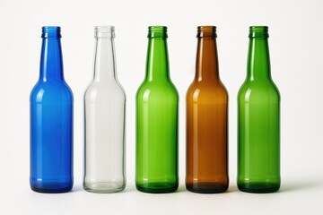 Vibrant glass bottles without contents arranged on a plain white surface