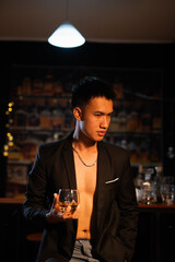 Closeup businessmen holding a glass of whiskey