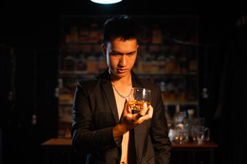 Closeup businessmen holding a glass of whiskey