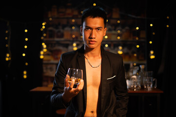 Closeup businessmen holding a glass of whiskey