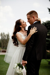 Bride and Groom Hugging in Nature