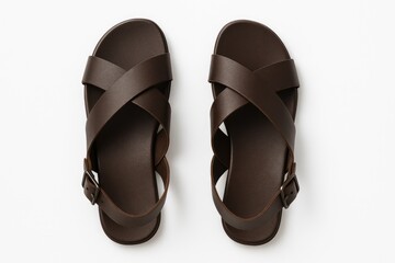 Brown leather footwear with open toes on a plain white backdrop