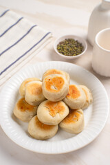 Bakpia is a flat round cookie, made from a mixture of green beans and sugar, then wrapped in flour...