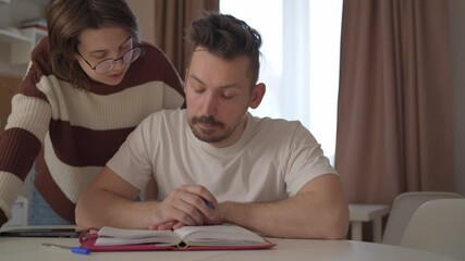 A young couple discusses home renovation and shares household tasks, capturing authentic moments of teamwork and love. Perfect for lifestyle, relationship, and DIY content