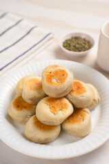 Bakpia is a flat round cookie, made from a mixture of green beans and sugar, then wrapped in flour dough and baked. This cookie is popular as a typical Yogyakarta souvenir.