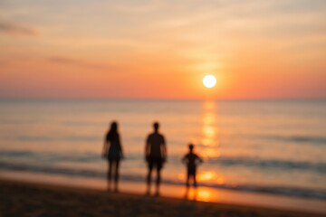 Blurry abstract backdrop featuring stunning sunrise hues with silhouetted figures on the shoreline