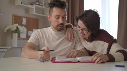 A young couple discusses home renovation and shares household tasks, capturing authentic moments of teamwork and love. Perfect for lifestyle, relationship, and DIY content