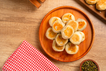 Bakpia is a flat round cookie, made from a mixture of green beans and sugar, then wrapped in flour dough and baked. This cookie is popular as a typical Yogyakarta souvenir.