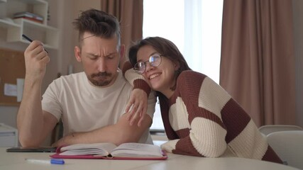 A young couple discusses home renovation and shares household tasks, capturing authentic moments of teamwork and love. Perfect for lifestyle, relationship, and DIY content