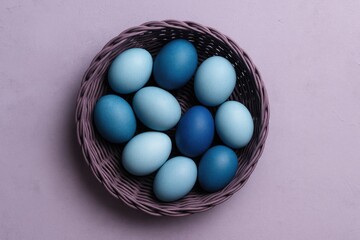 Colorful Easter Eggs in a Pastel Basket for Spring Decor, Flatlay Arrangement