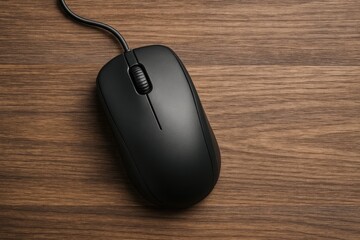 Wired computer mouse resting on a wooden surface