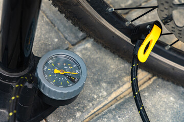 Flat tire on electric bike, pumping air into bike inner tube, bike inspection