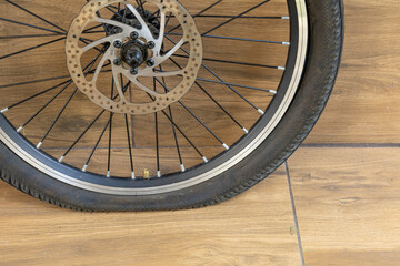 Flat tire on electric bike, pumping air into bike inner tube, bike inspection