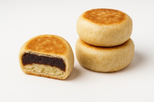 A single bakpia pastry displayed on a plain white backdrop