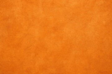 Vibrant orange abstract wall with textured concrete surface
