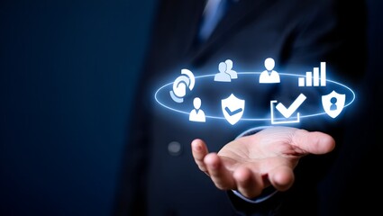 A businessman in a dark suit holding out his hand, with glowing digital holographic icons floating above it, representing cybersecurity, cloud data, analytics, secure access, and user profiles