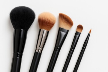 High-quality professional makeup brushes displayed on a plain white backdrop