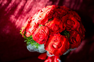 Red rose bouquet with leaves. Vibrant red roses arranged with greenery create a stunning floral...