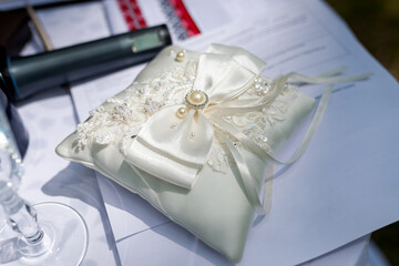 Wedding ring pillow. A beautiful wedding ring pillow adorned with a satin bow and embellishments...