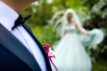 Couple weds in nature. A happy couple celebrates their wedding in a lush garden filled with...