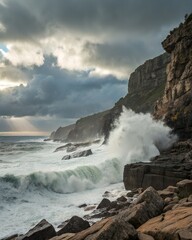 Crashing waves against rocky cliffs under a dramatic cloudy sky at the coast