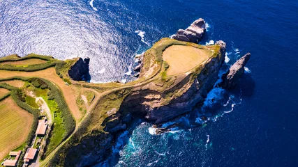 Fotobehang Azores , Portugal. amazing Sao Miguel island scenic places. aerial drone panorama of miradouro do Cintrao with impressive rugged rocks and ocean © Freesurf