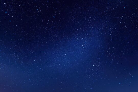 A tranquil deep blue night sky adorned with shimmering stars for minimalist aesthetics and celestial-inspired projects, ideal for evoking peaceful moods and dreamy visuals