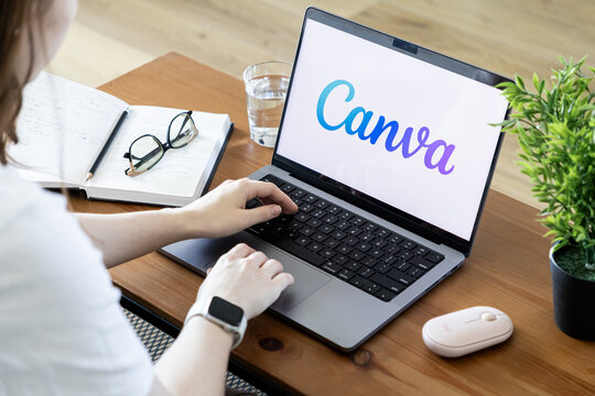 Poznan, Poland - June 15, 2025: Canva application prominently displayed on a laptop screen, actively used for graphic design, fostering creativity in a modern workspace