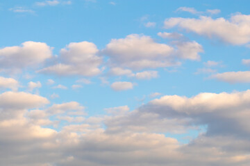 Fototapeta premium Soft pastel clouds in blue evening sky.