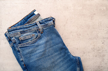 Folded blue classic jeans on desk with space for idea as flat lay