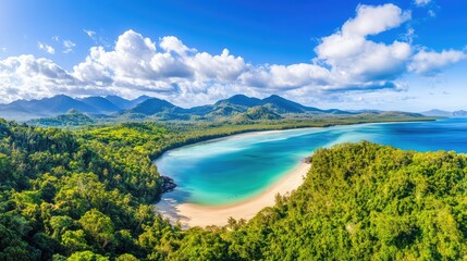 Obraz premium Breathtaking mix of rainforest terrain and beach scenery under sunlit skies and turquoise seas