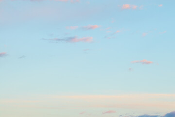 Soft pastel clouds in blue evening sky