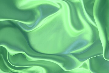 Pearl-salad silk background. The folds of the fabric create an abstract place for the text.