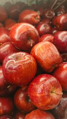 Close up pile of tasty fresh apples sold at the market as a background.