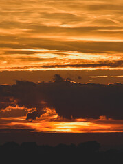 Sunset scene with skyline silhouette and glowing atmospheric sky