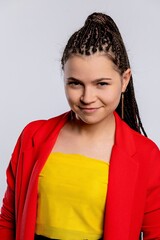 A Confident and Stylish Young Girl with Beautiful Braids Wearing a Fashionable Outfit