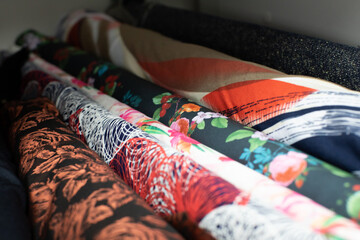 A Vibrant and Colorful Collection of Fashion Fabrics Gracefully Displayed for Everyone