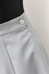 Discover the Elegant Gray Skirt with beautiful Button Detail, designed for Fashion Lovers