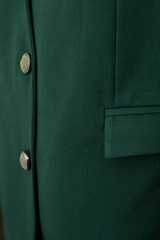 This Elegant Green Fabric with exquisite Buttons Detail is perfect for stylish Fashion and Design